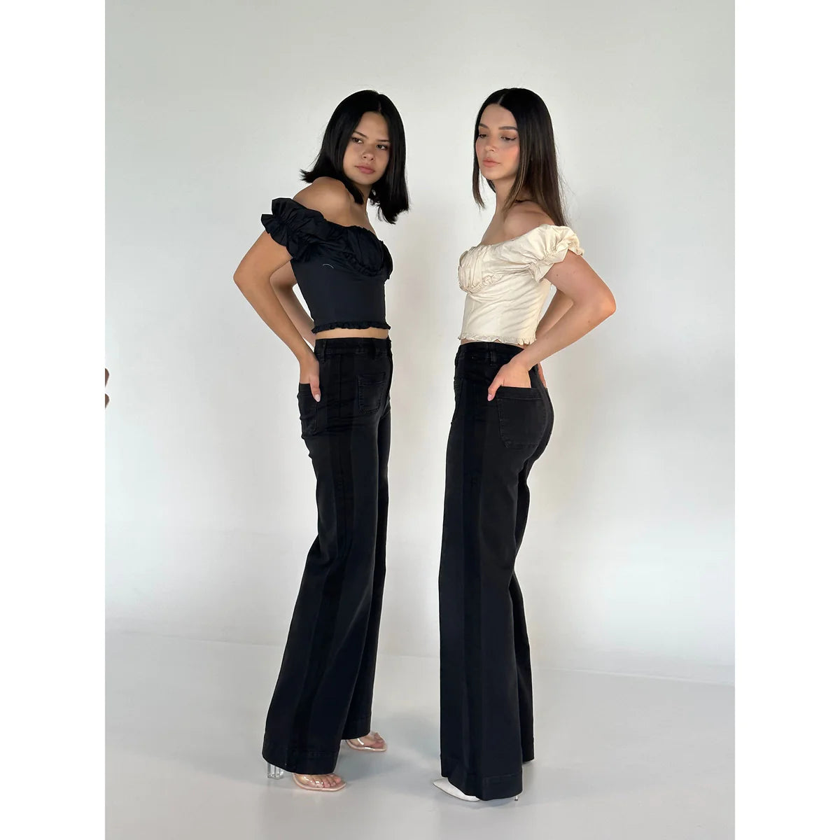 two girl showing how to style edgy and ample wide leg jeans in a OnPost Style