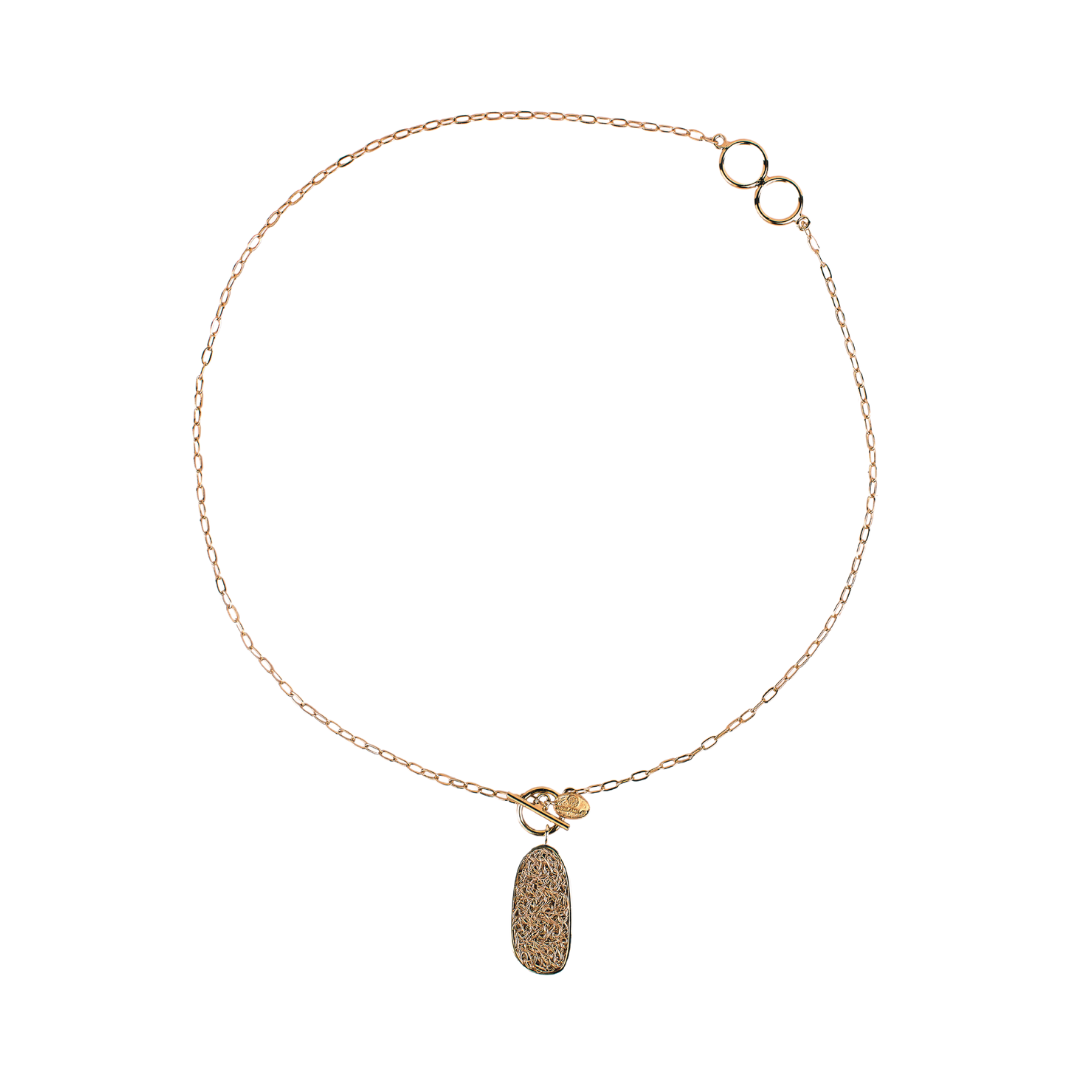 Artisan-crafted gold necklace with a distinctive and modern design, perfect for bold statements.